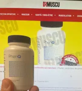 Bouteille PhenQ devant un écran d'ordinateur.