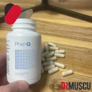 Bouteille PhenQ et capsules sur table.