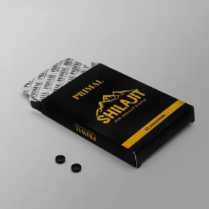 Boîte ouverte de comprimés Shilajit noire et jaune de la marque primal